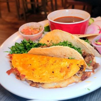 Taqueria El Mexicano signature dishes Tacos ChilangosChoriquesoAl Pastor Taco